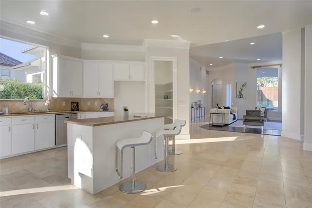 a kitchen with counter top space cabinets and appliances