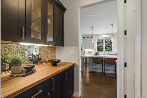 a kitchen with stainless steel appliances kitchen island a large island in the center