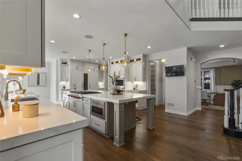 a dining room with furniture window and wooden floor