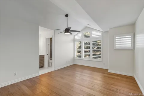 a bathroom with a granite countertop sink mirror toilet and shower