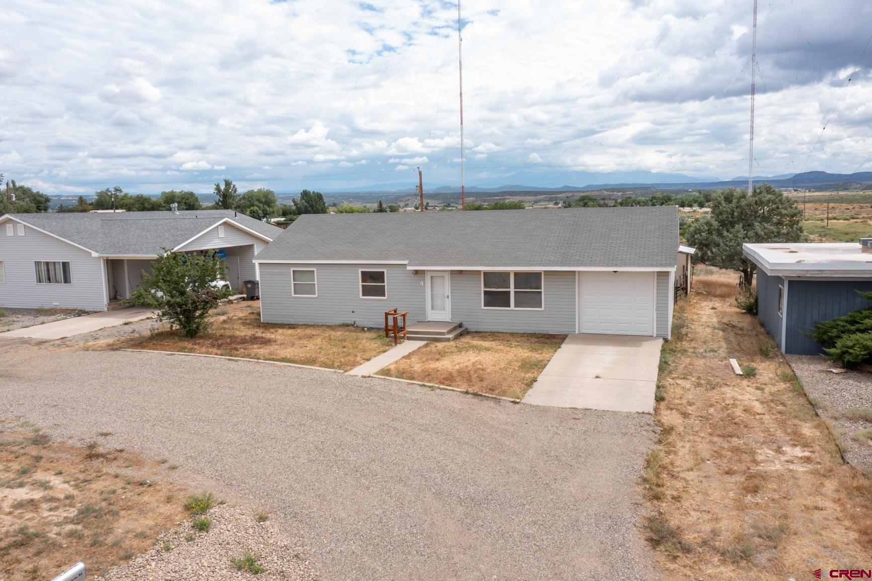 4 North Dolores Road Cortez, CO 81321 - Photo 12 of 24 front view of a house with a yard