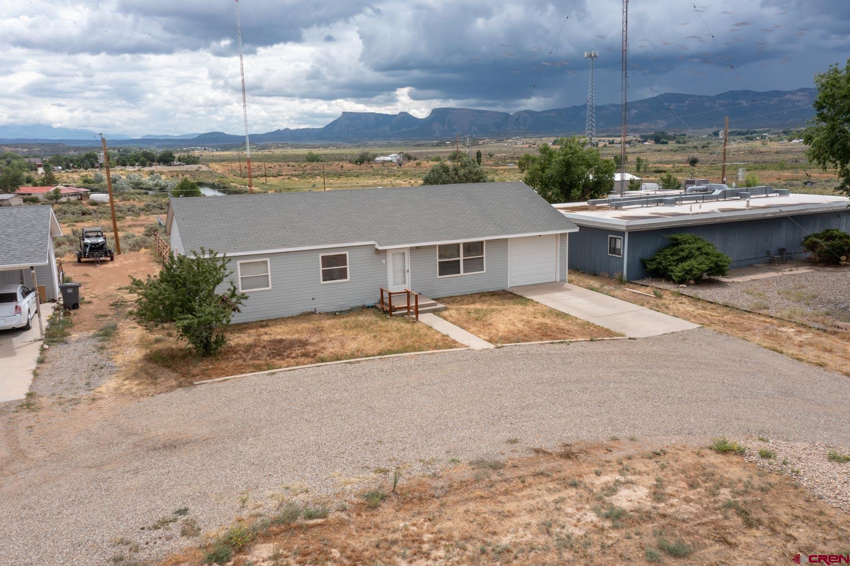 4 North Dolores Road Cortez, CO 81321 - Photo 15 of 24 a view of a terrace with a barbeque