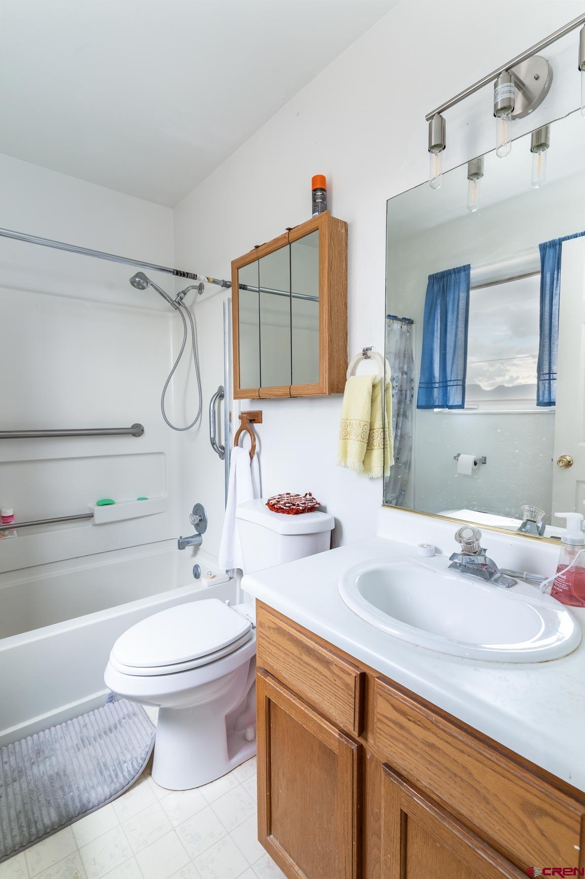 4 North Dolores Road Cortez, CO 81321 - Photo 17 of 24 a bathroom with a sink a toilet and shower