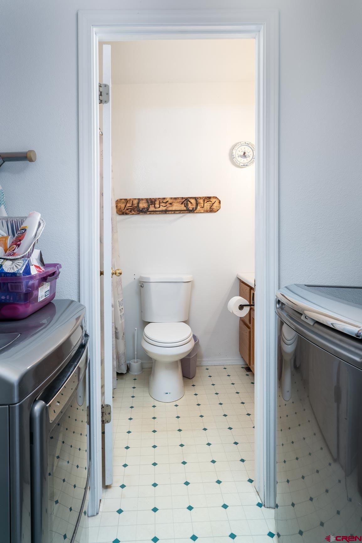 4 North Dolores Road Cortez, CO 81321 - Photo 21 of 24 a bathroom with a sink toilet and shower