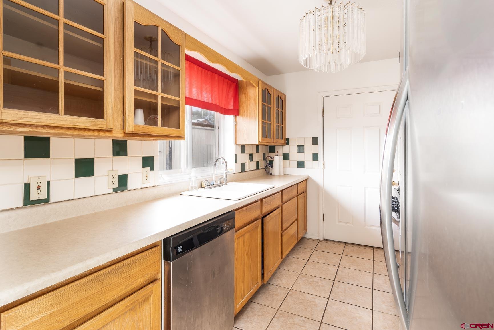 4 North Dolores Road Cortez, CO 81321 - Photo 24 of 24 a kitchen with a sink and a refrigerator