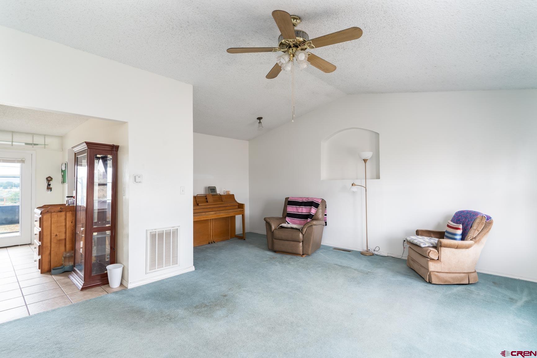 4 North Dolores Road Cortez, CO 81321 - Photo 5 of 24 a living room with furniture and a ceiling fan