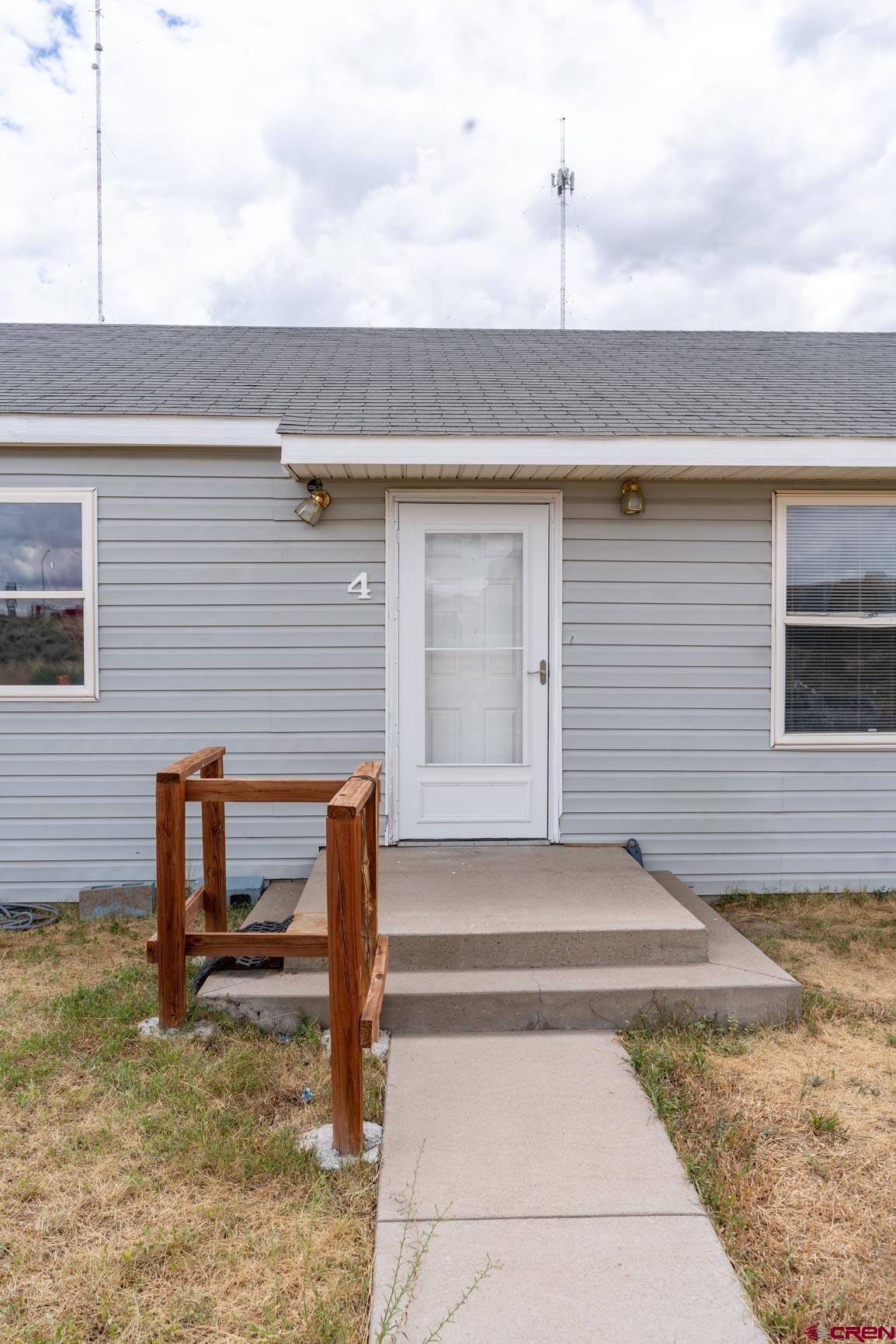 4 North Dolores Road Cortez, CO 81321 - Photo 9 of 24 a front view of a house with garden