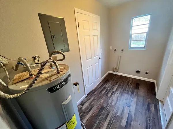 a view of a hardwood floor and in a bathroom