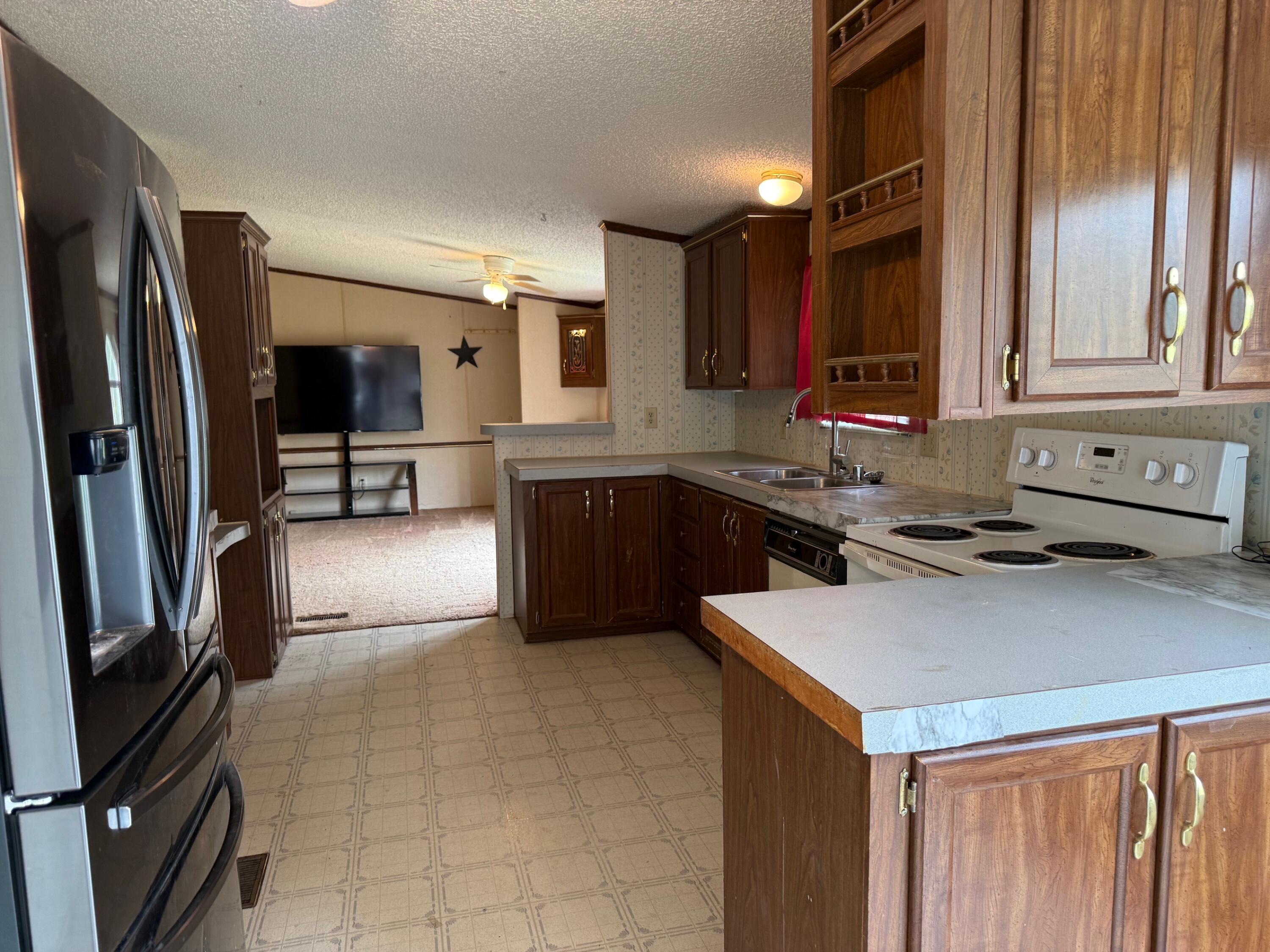 2468 Vly Ctr Road Monterey, VA 24465 - Photo 13 of 28 a kitchen with stainless steel appliances a sink stove and refrigerator