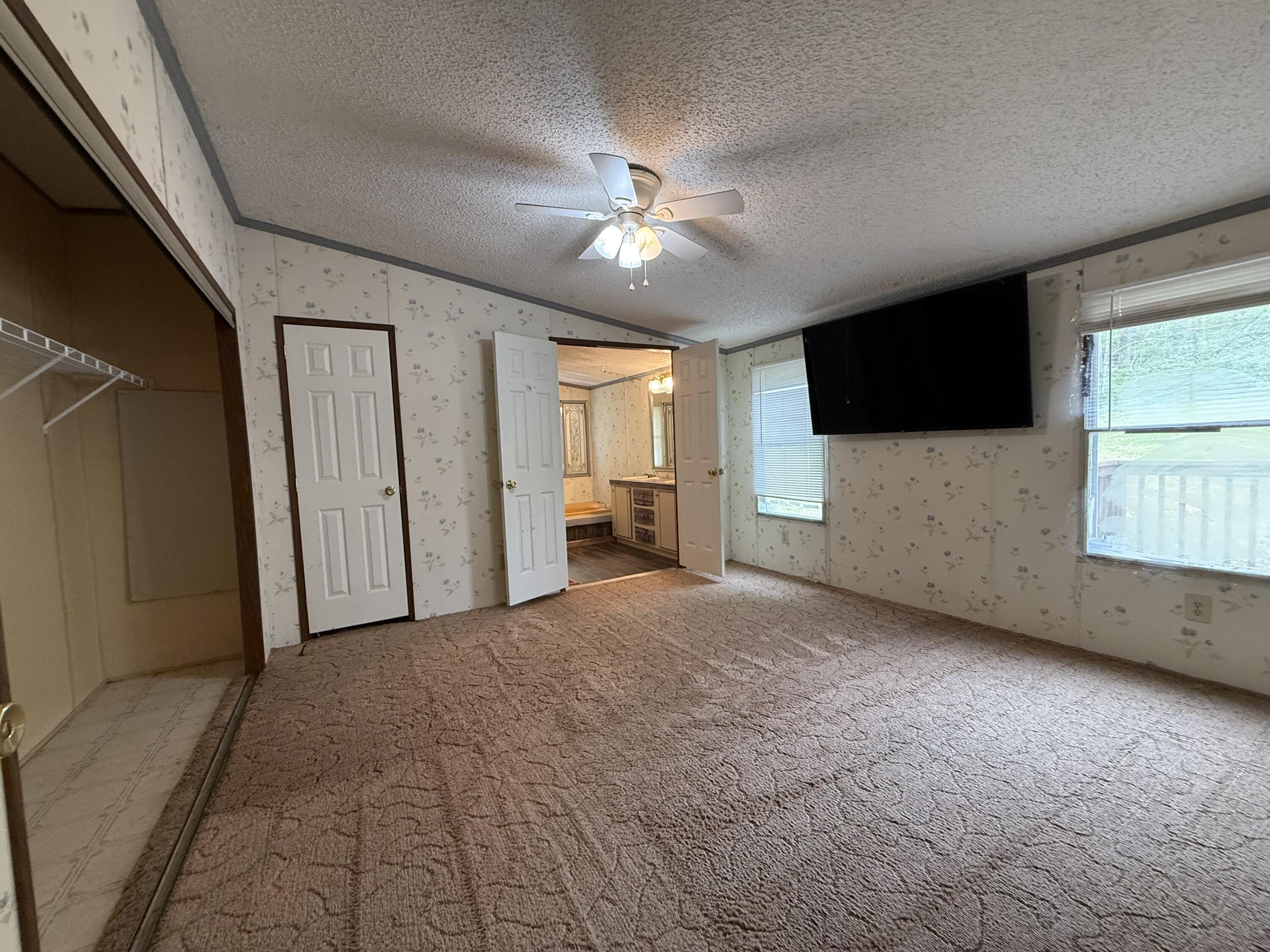 2468 Vly Ctr Road Monterey, VA 24465 - Photo 17 of 28 a view of a livingroom with a flat screen tv