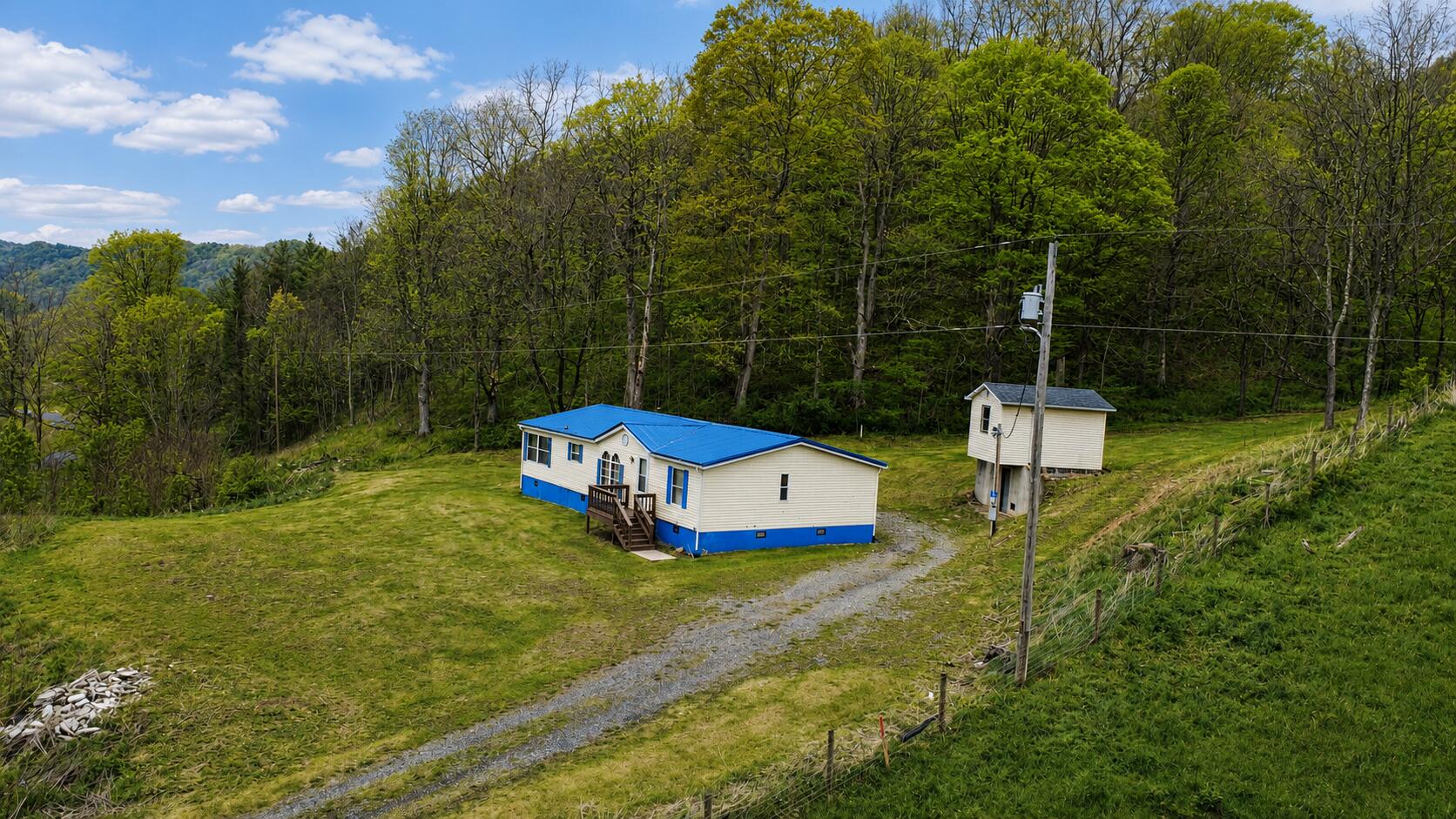 2468 Vly Ctr Road Monterey, VA 24465 - Photo 2 of 28 a view of a house with a yard and sitting area