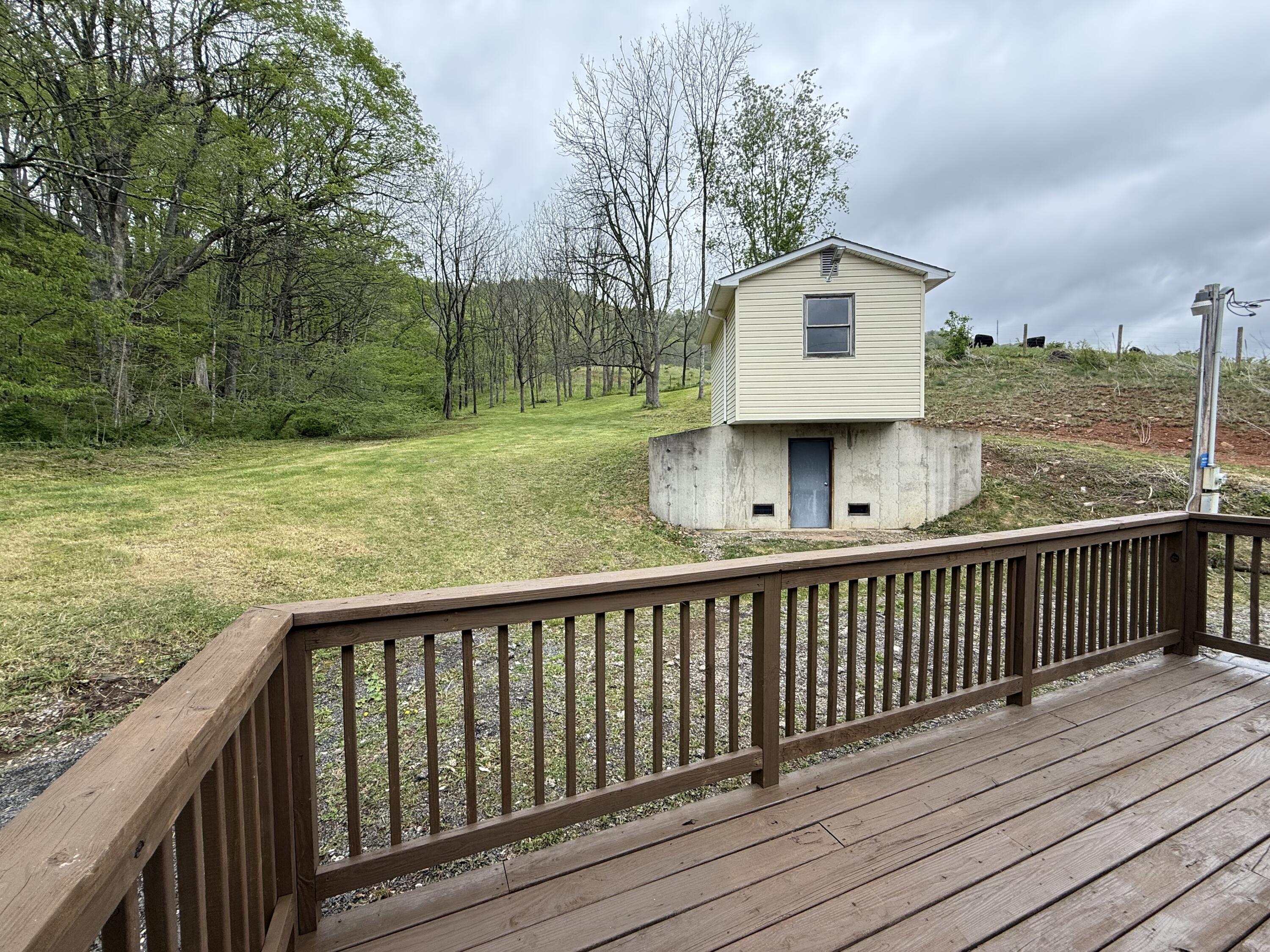 2468 Vly Ctr Road Monterey, VA 24465 - Photo 22 of 28 a view of a wooden deck and trees with wooden fence
