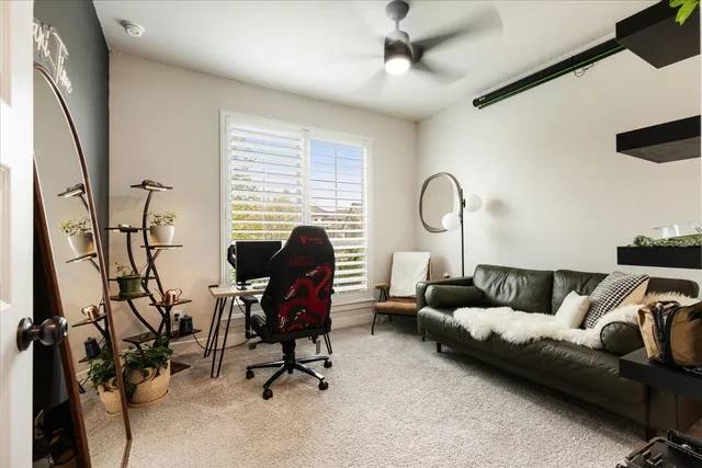 a view of a livingroom with workspace and a couch