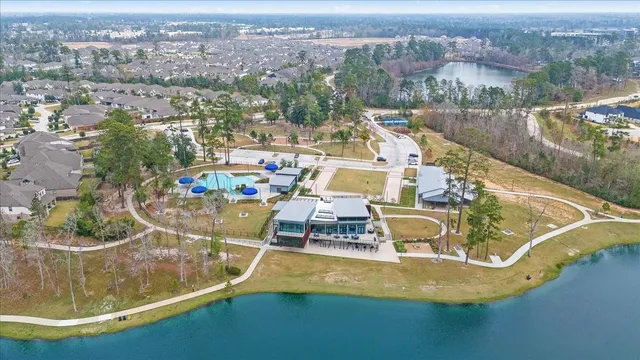 an aerial view of a house with a swimming pool