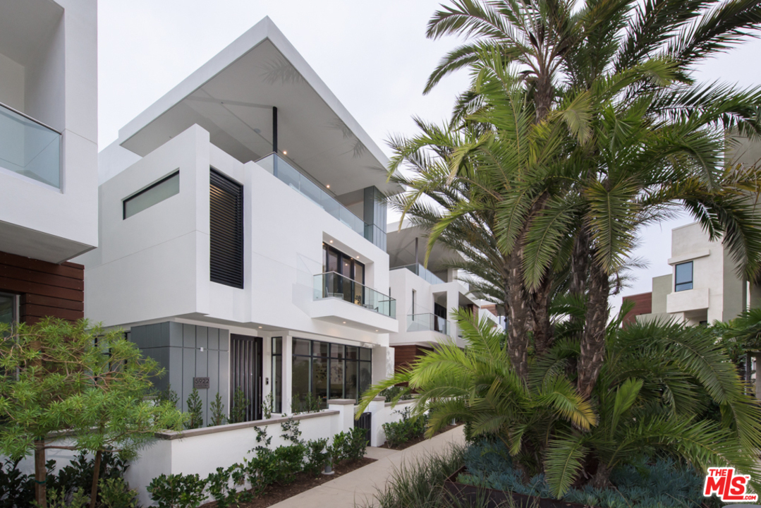 5922 Firefly Place Playa Vista, CA 90094 - Photo 1 of 1 a view of white house with a yard and potted plants