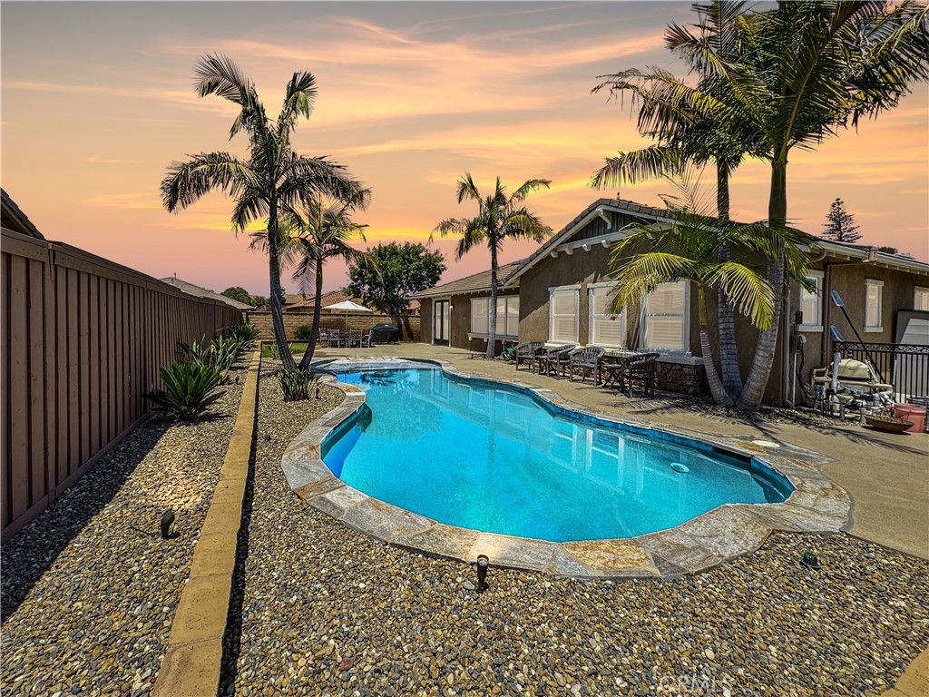 a view of a swimming pool with a patio