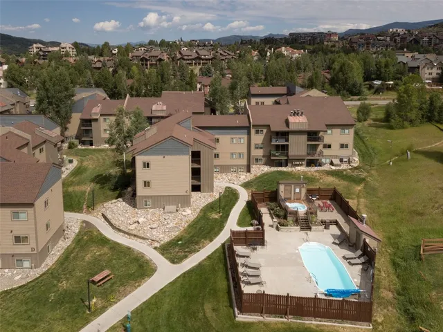 an aerial view of a house with a ocean view