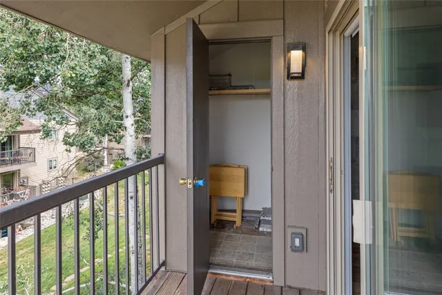 a view of a brick house with a large window
