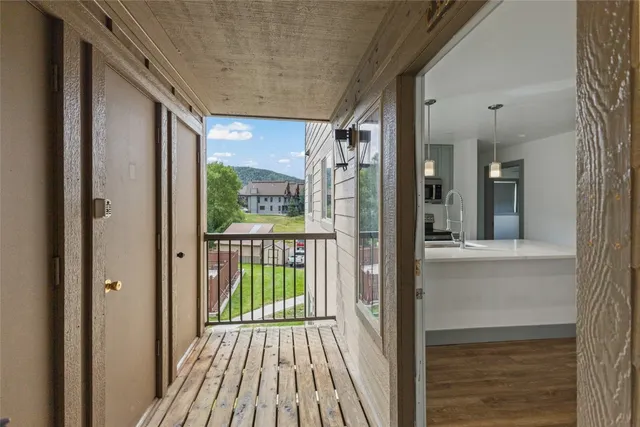 a sign of golf club on a tree