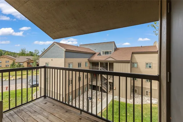 a view of a balcony with wooden floor
