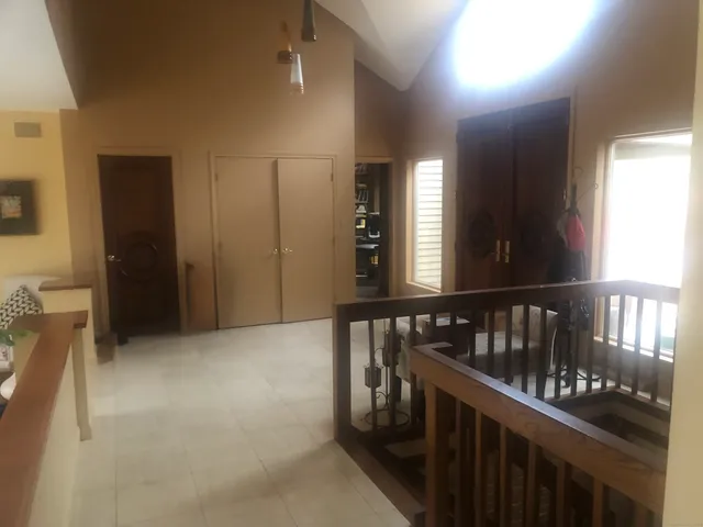 a view of gallery with wooden floor