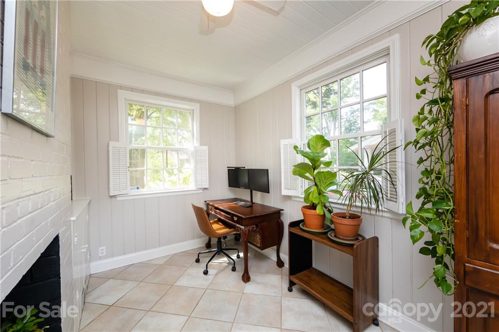 816 Sedgefield Road Charlotte, NC 28209 - Photo 15 of 29 a work room with furniture and a potted plant