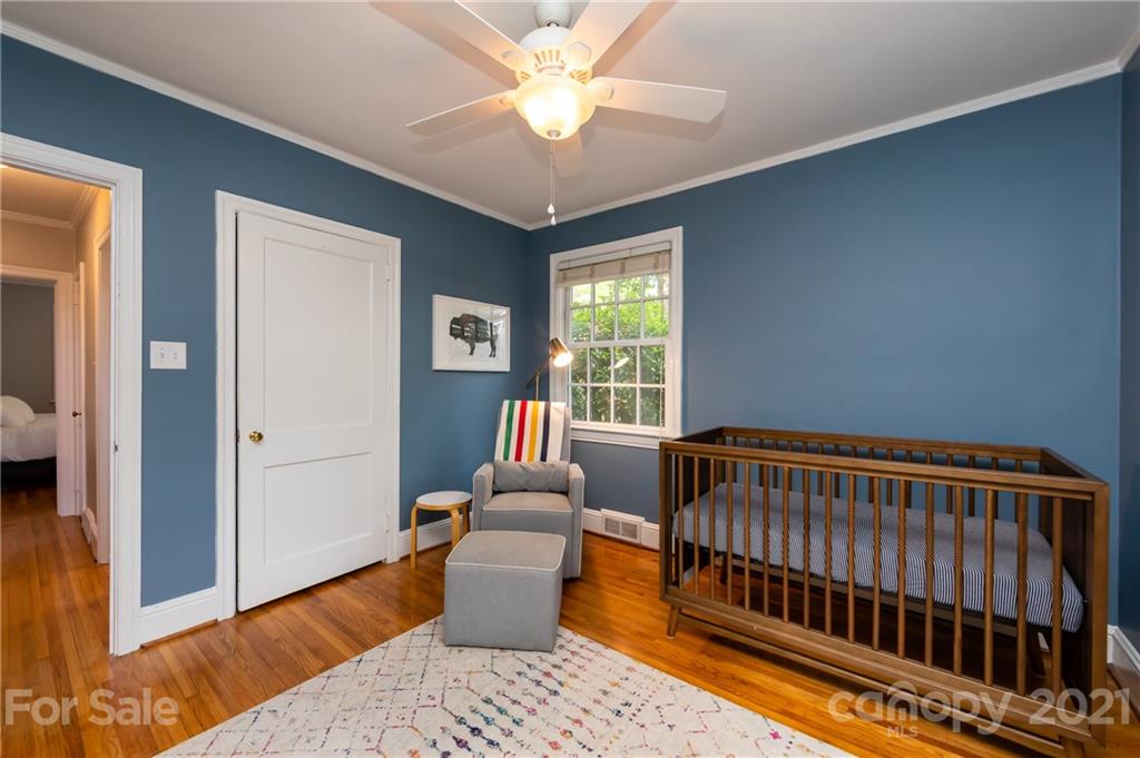 816 Sedgefield Road Charlotte, NC 28209 - Photo 24 of 29 a bedroom with furniture and a window
