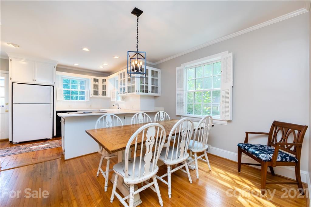 816 Sedgefield Road Charlotte, NC 28209 - Photo 9 of 29 a view of a dining room with furniture window and wooden floor