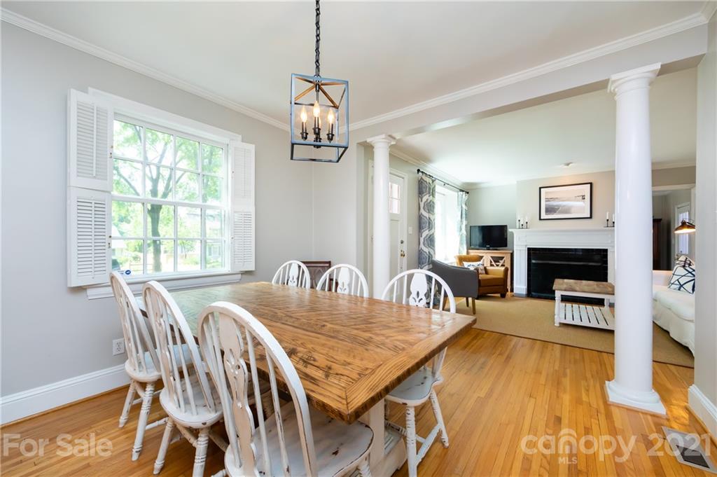 816 Sedgefield Road Charlotte, NC 28209 - Photo 10 of 29 a view of a dining room with furniture window and wooden floor