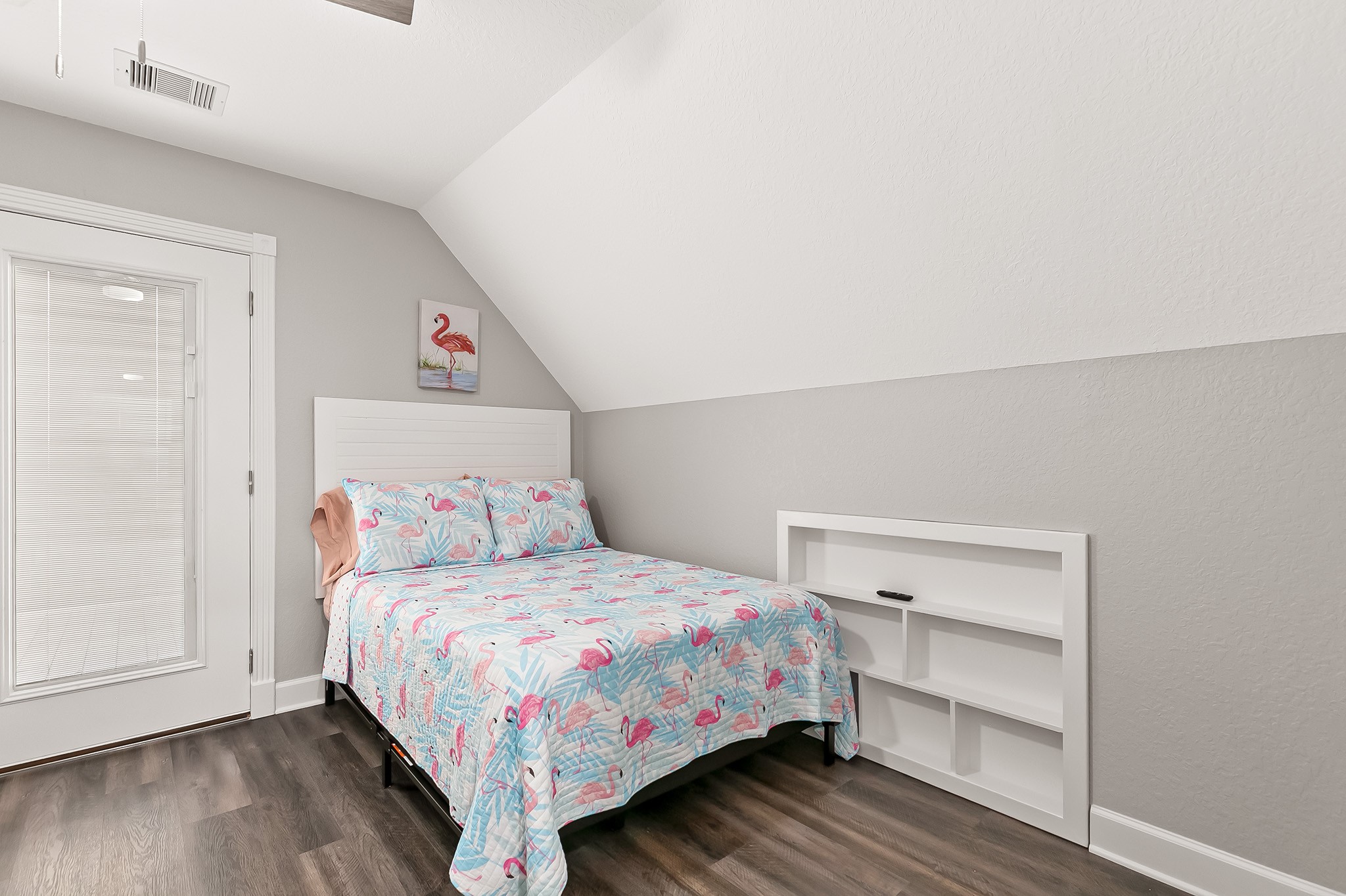 106 Pelican Place Surfside Beach, TX 77541 - Photo 26 of 46 a bedroom with a bed and wooden floor