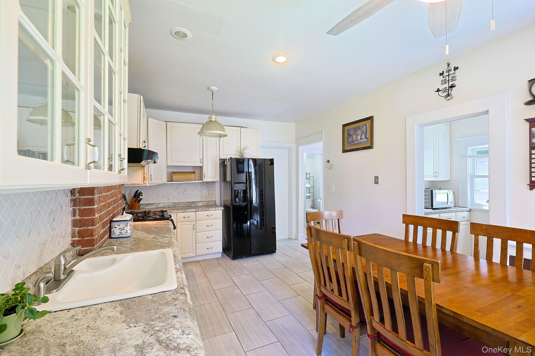 9 Library Road Tuxedo Park, NY 10987 - Photo 9 of 37 Light filled hight ceilings plenty of cabinetry and counter space.