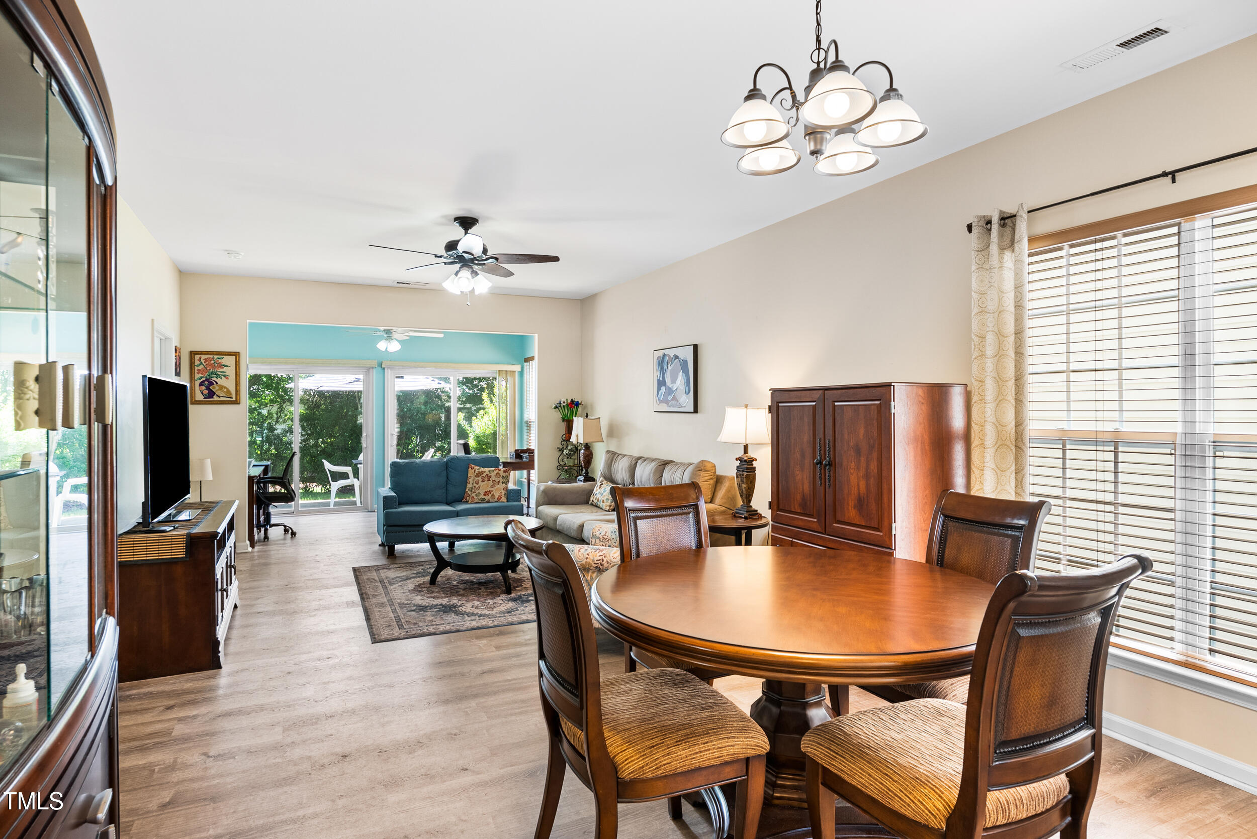 575 Tomkins Loop Cary, NC 27519 - Photo 12 of 44 a view of a dining room with furniture window and wooden floor