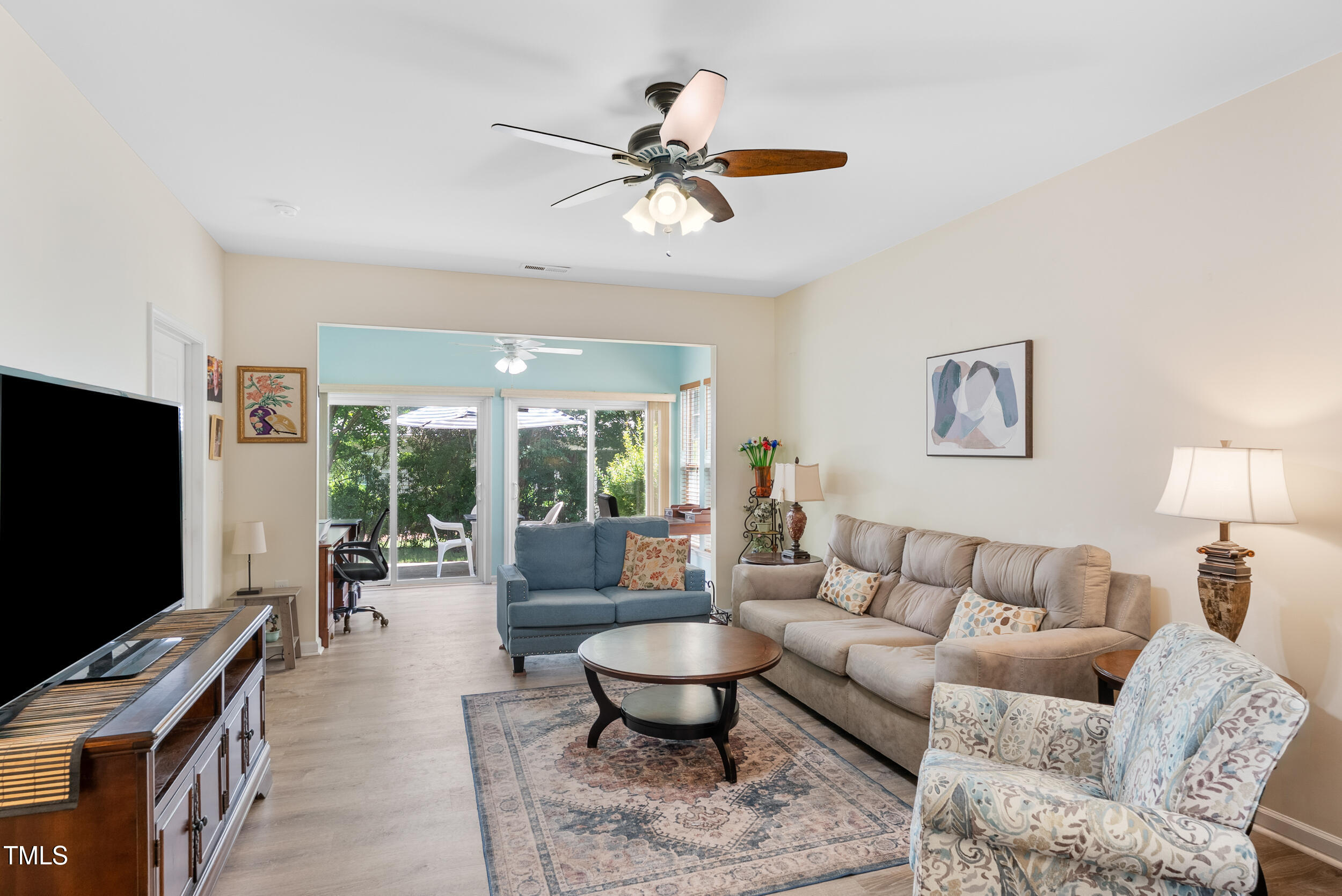 575 Tomkins Loop Cary, NC 27519 - Photo 13 of 44 a living room with furniture and a flat screen tv