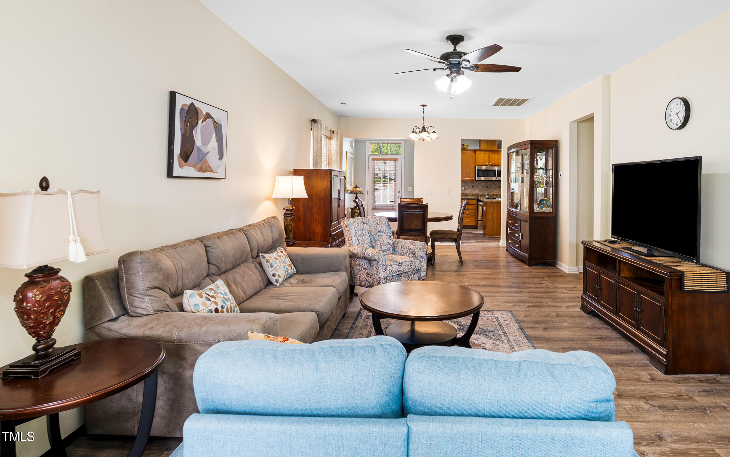575 Tomkins Loop Cary, NC 27519 - Photo 16 of 44 a living room with furniture and a flat screen tv