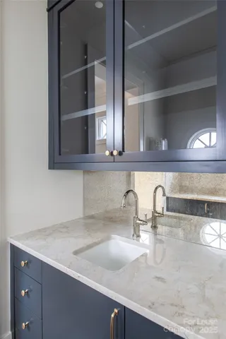 a close view of sink and cabinets