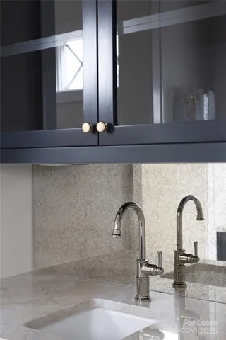 a kitchen with kitchen island a sink a counter space and a window