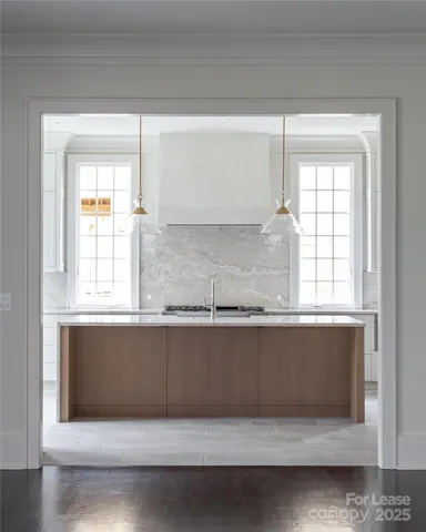 a bathroom with a sink a bathtub and window