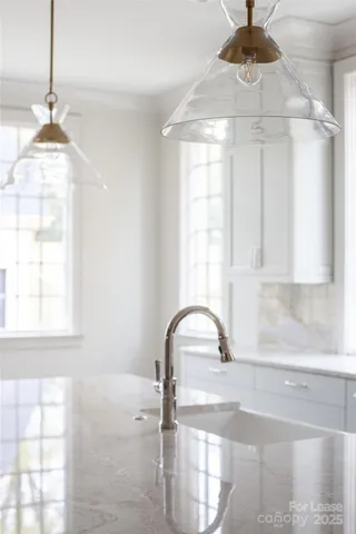 a stove top oven sitting inside of a kitchen