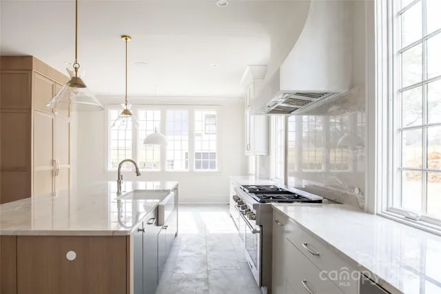 a large bathroom with a tub sink and mirror