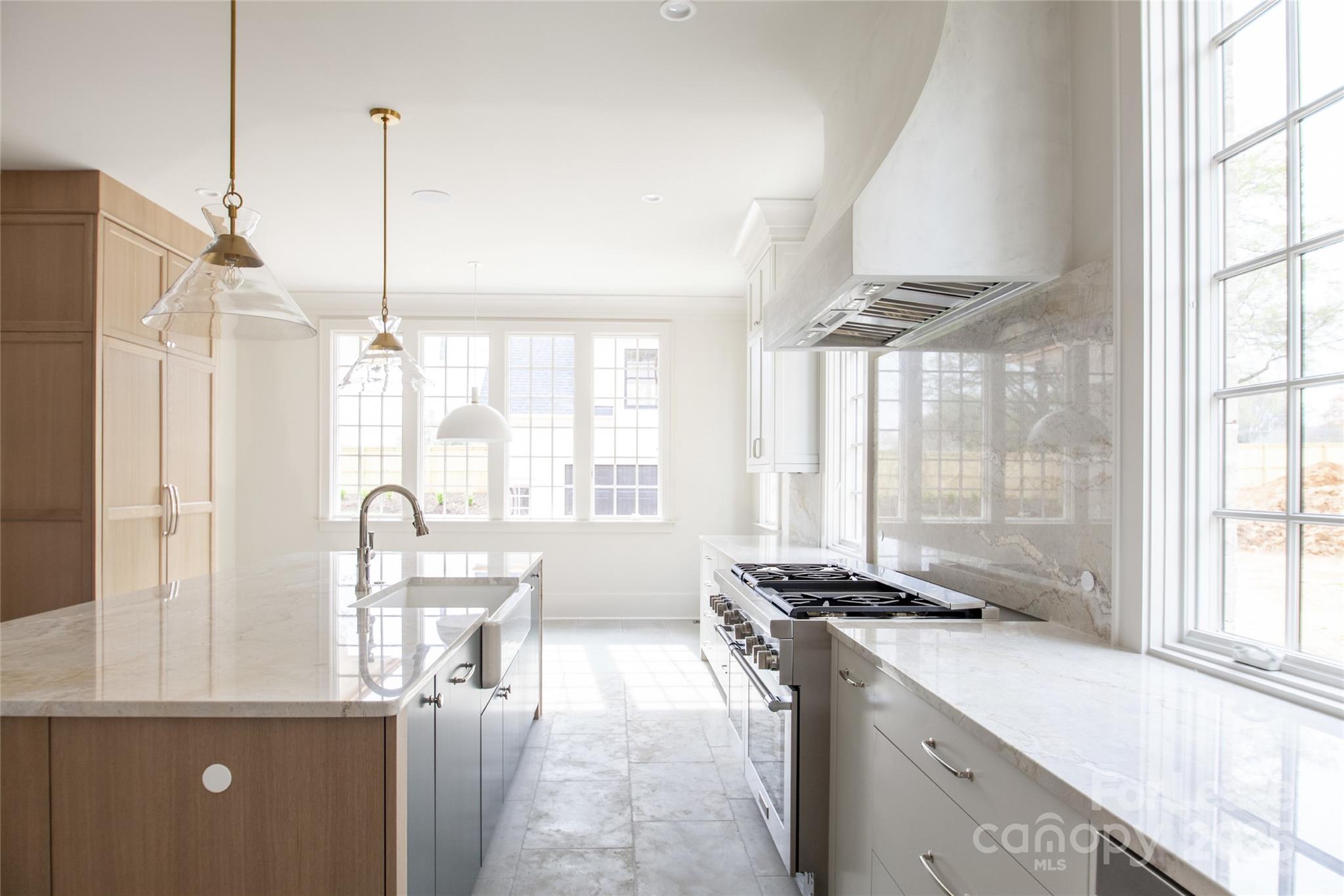 5024 Gilchrist Road Charlotte, NC 28211 - Photo 32 of 48 a view of a kitchen with kitchen island a large window