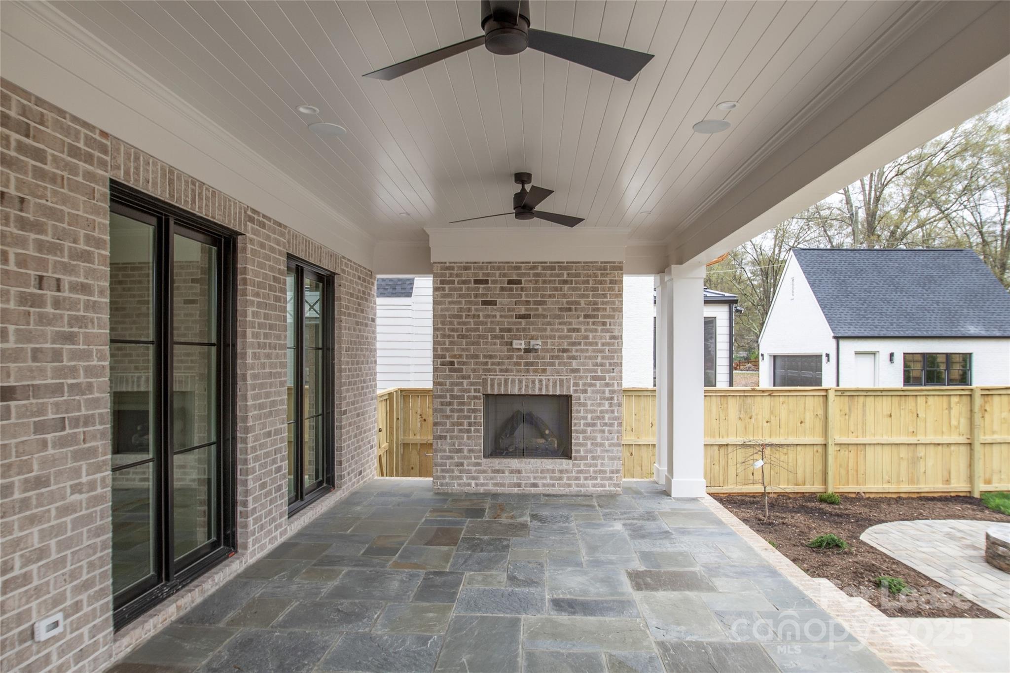 5024 Gilchrist Road Charlotte, NC 28211 - Photo 4 of 48 a view of an empty room with a fireplace and a window