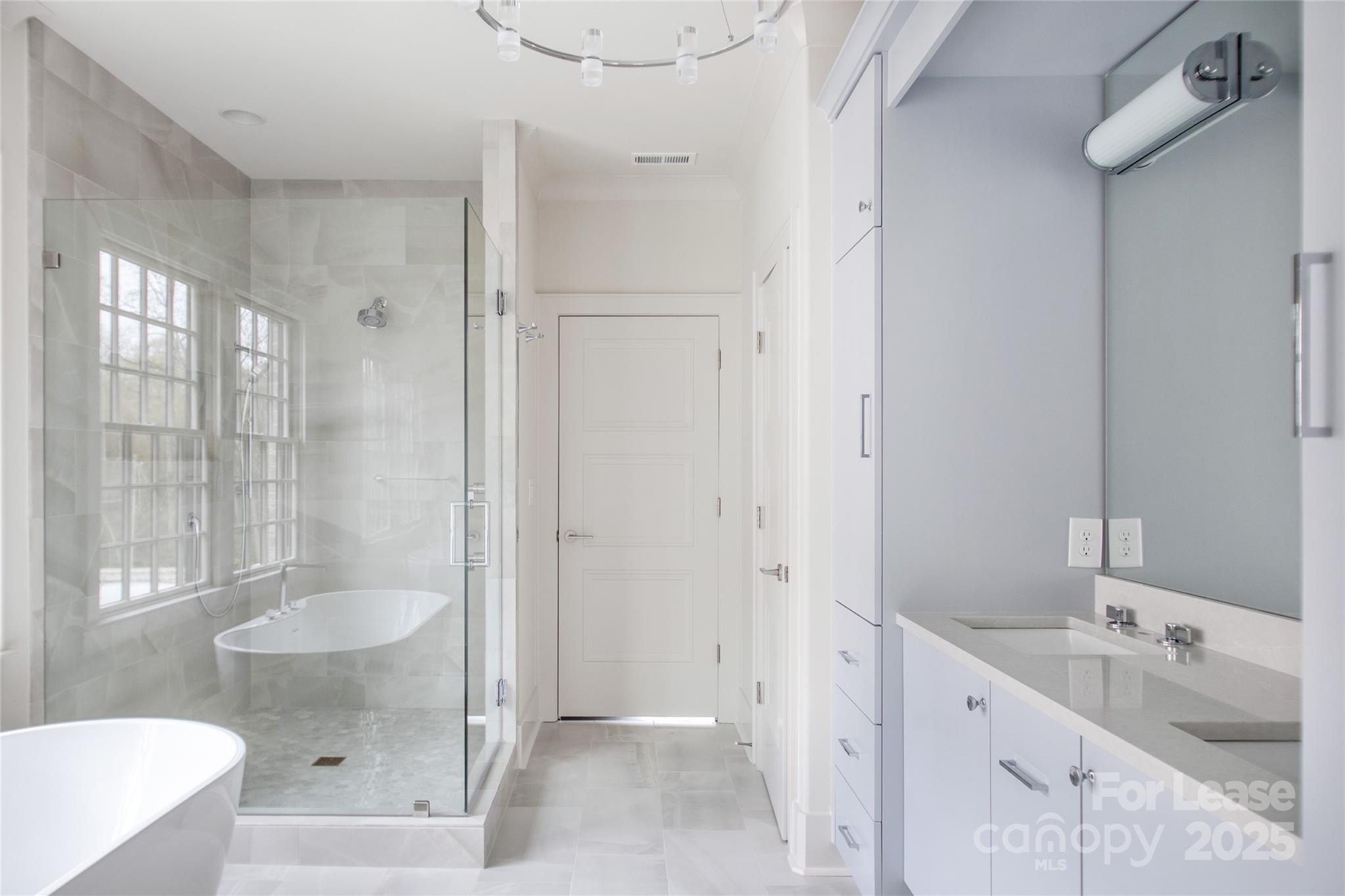 5024 Gilchrist Road Charlotte, NC 28211 - Photo 43 of 48 a bathroom with a tub sink and mirror