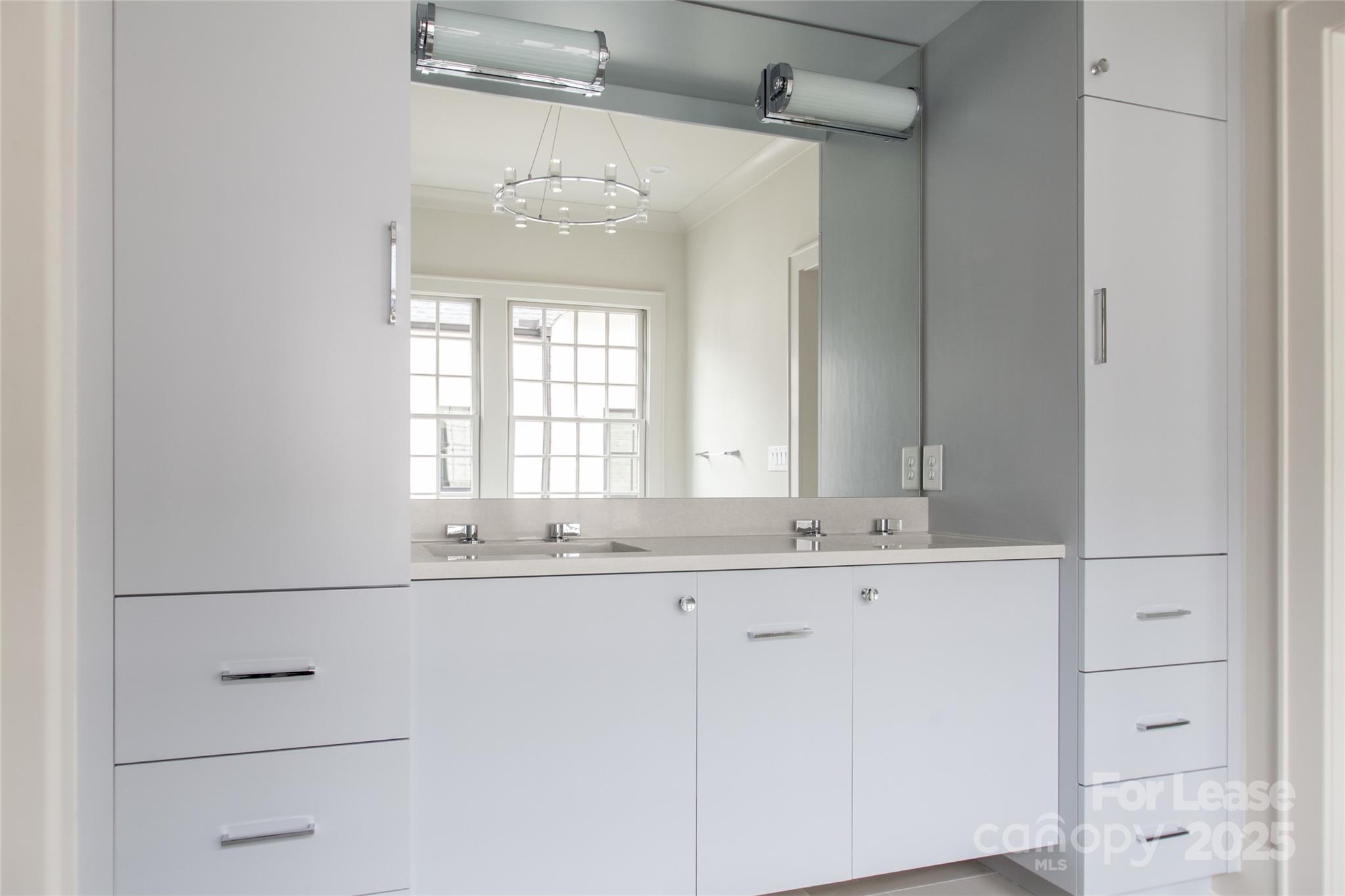 5024 Gilchrist Road Charlotte, NC 28211 - Photo 44 of 48 a bathroom with a sink and a mirror
