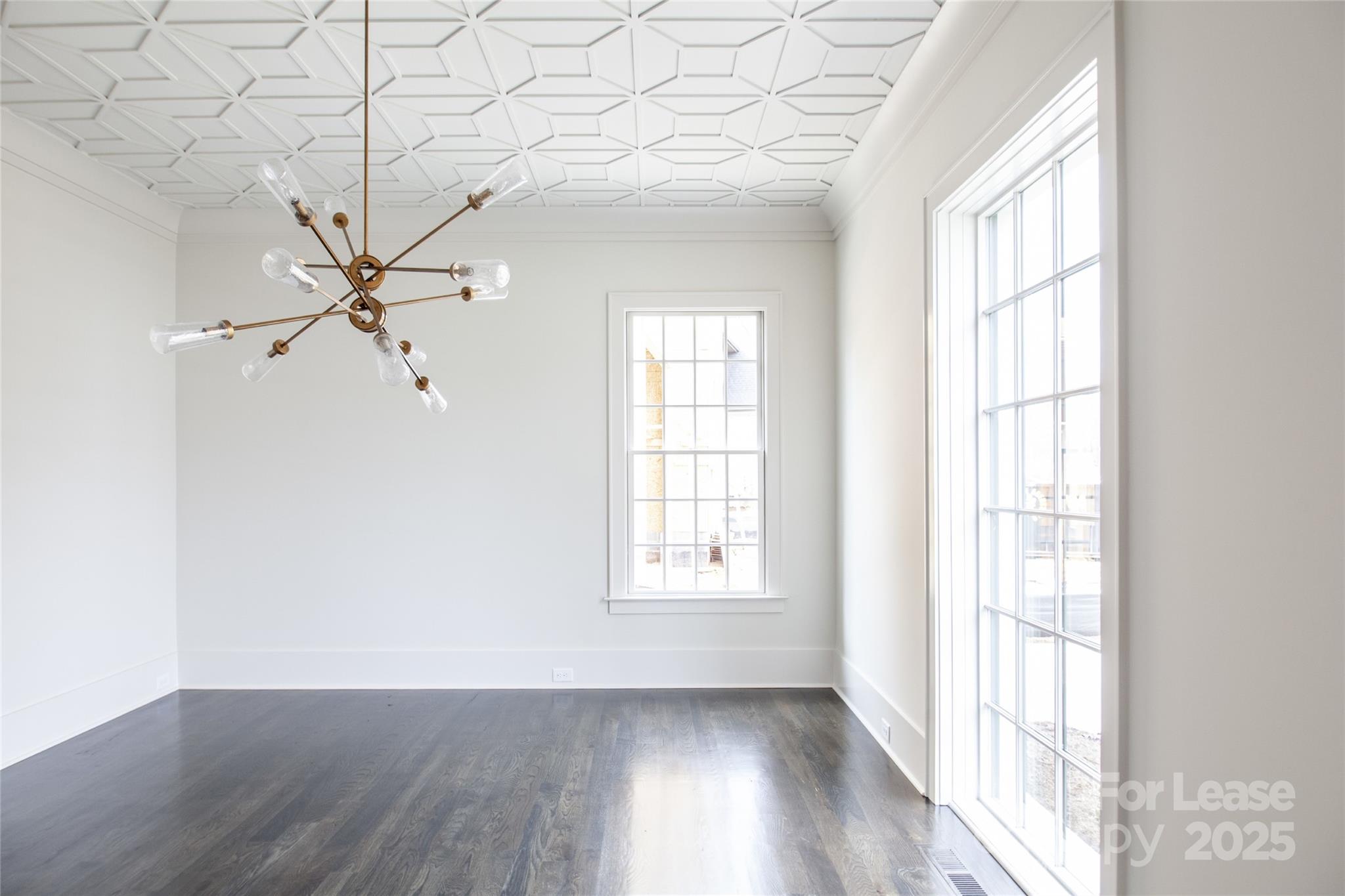 5024 Gilchrist Road Charlotte, NC 28211 - Photo 8 of 48 wooden floor in an empty room with a window