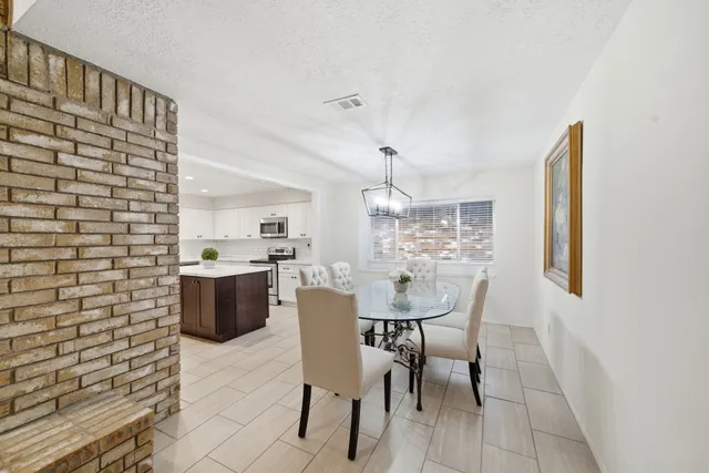a view of a dining room with furniture