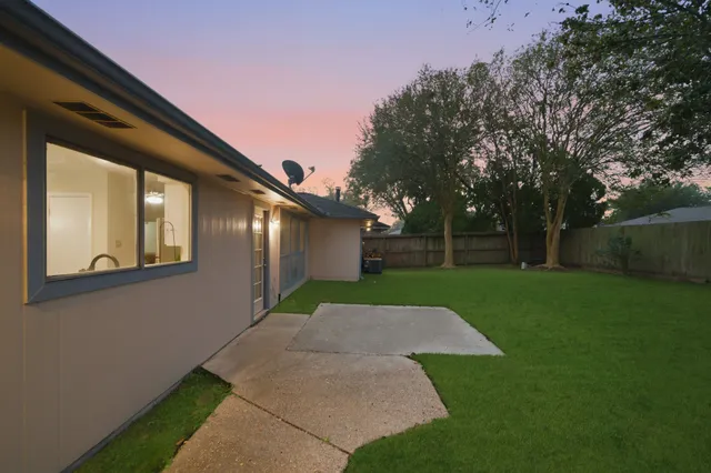 a view of backyard with green space