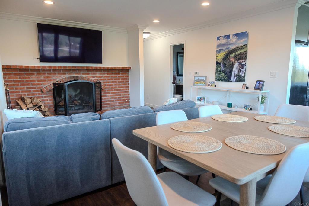 751 South Grade Road Alpine, CA 91901 - Photo 20 of 67 a dining room with furniture and a fireplace