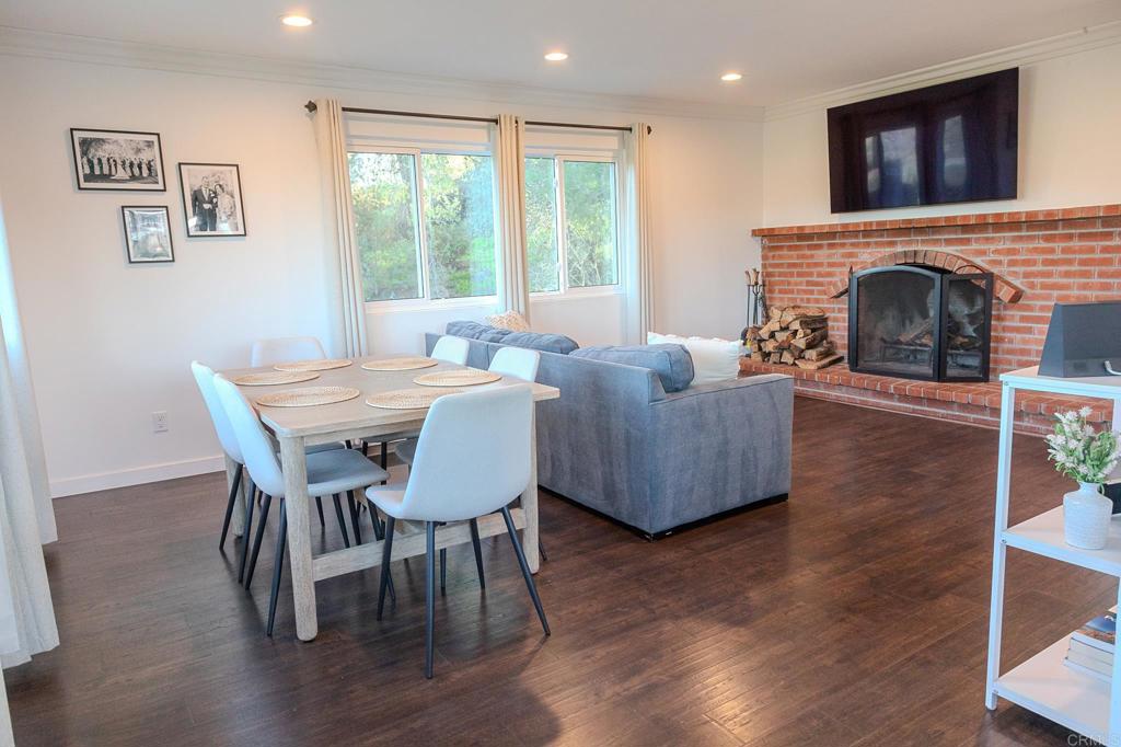 751 South Grade Road Alpine, CA 91901 - Photo 25 of 67 a living room with furniture a flat screen tv and a fireplace