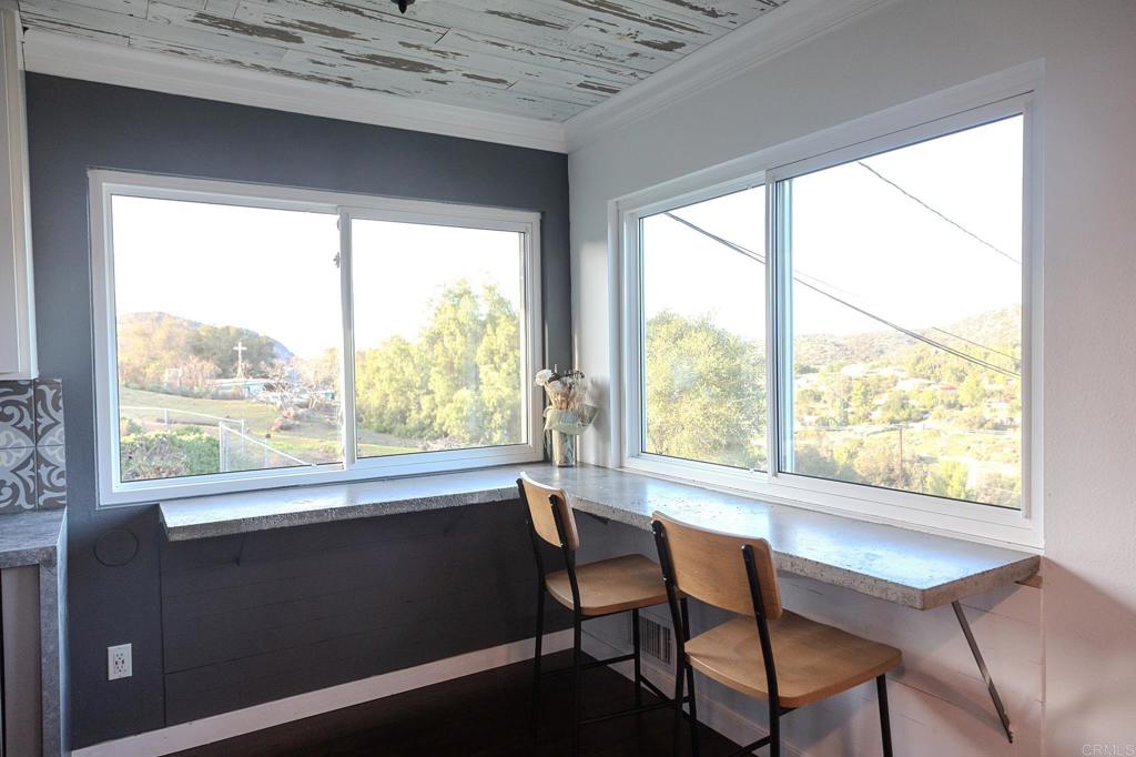 751 South Grade Road Alpine, CA 91901 - Photo 35 of 67 a view of a city from a dining room with large windows