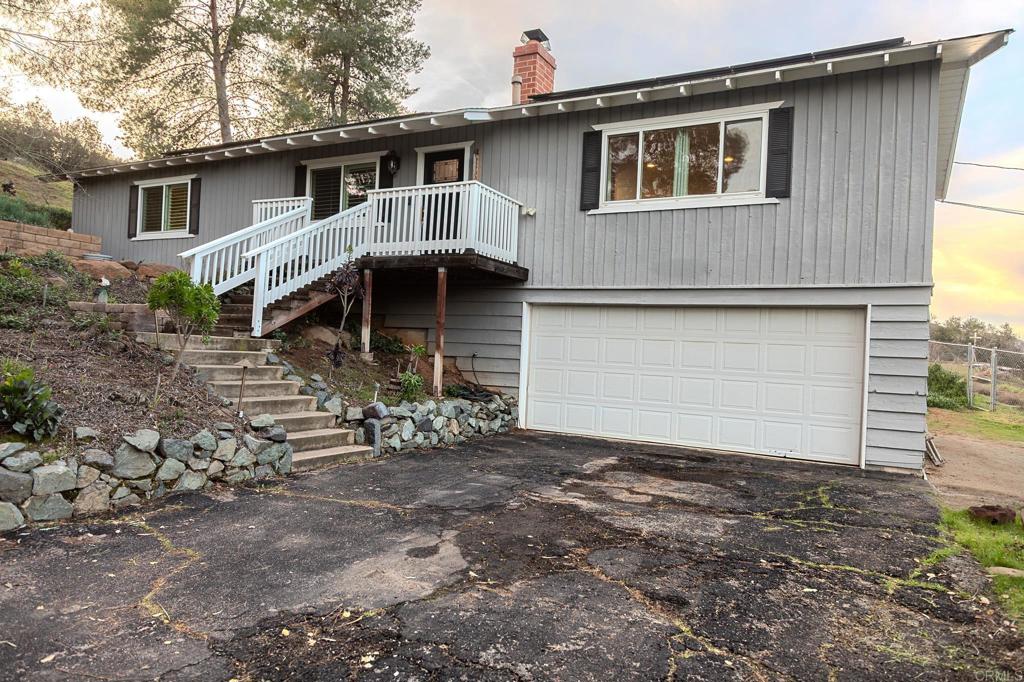 751 South Grade Road Alpine, CA 91901 - Photo 4 of 67 a front view of a house with garden